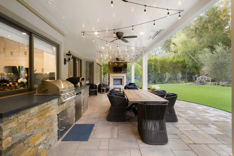 Outdoor living space with kitchen and seating on a beautiful patio Outdoor living space with kitchen and seating on a beautiful patio